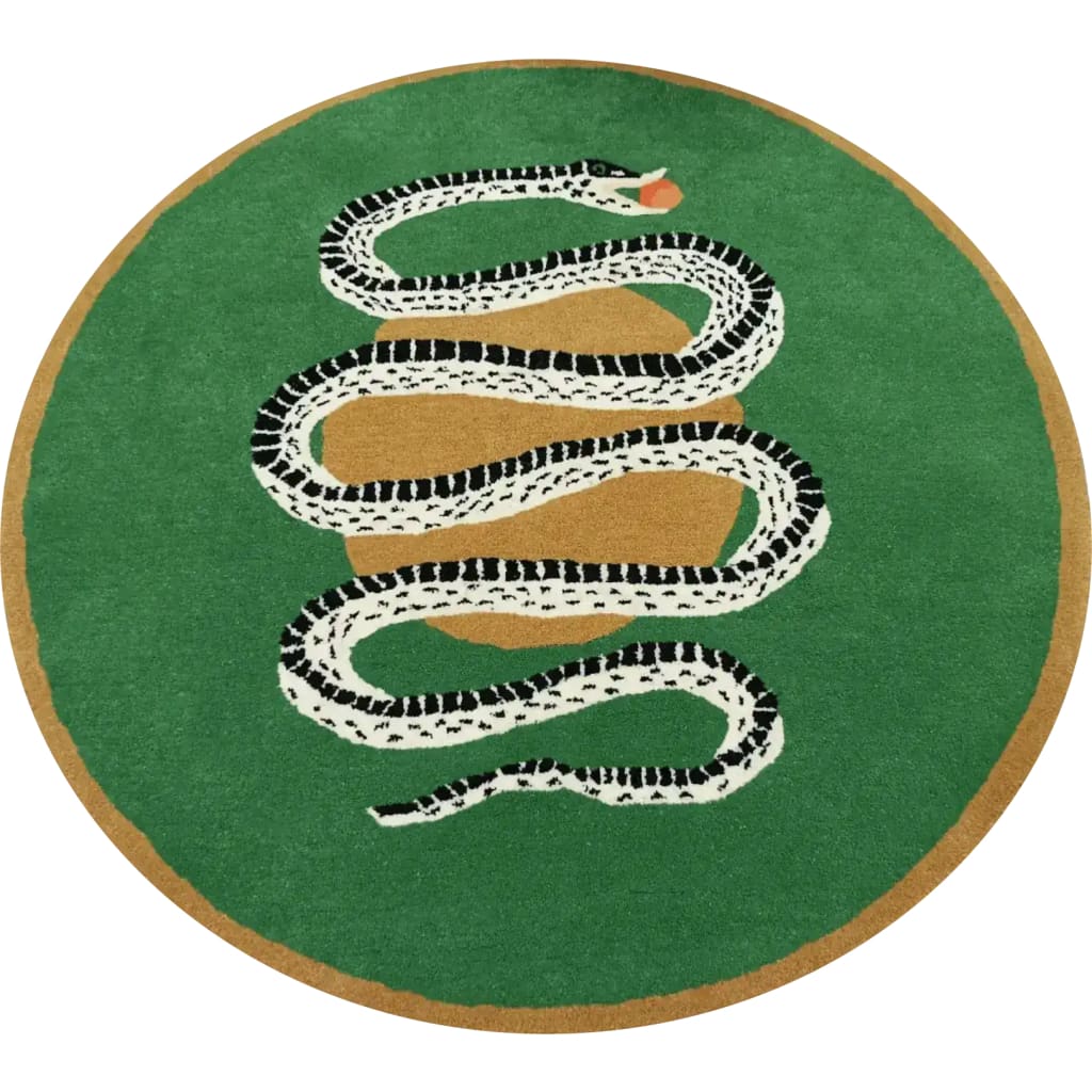 A vibrant round wool rug showcasing a striking snake and apple design on a lush green background. Perfect for a dining room, this large area rug blends bold style with functionality, ideal for formal dining room settings.