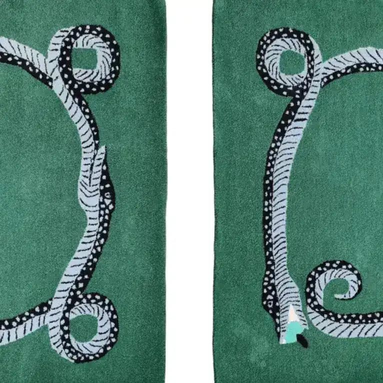 This image showcases a green hand-tufted wool area rug featuring a unique snake design with red evil eyes. Perfect as a vintage rug for the dining room or a formal dining room rug, it adds a touch of intrigue to any space. Ideal for use as kitchen rugs, hallway runner rugs, or even bathroom runner rugs, this wool rug brings both style and durability.