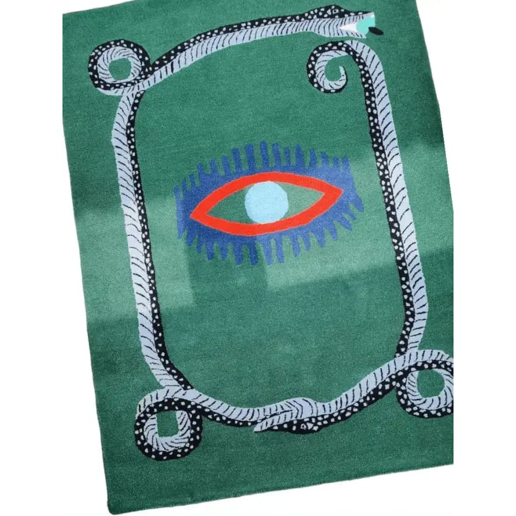 This vibrant area rug showcases a striking design with a snake border and a central red evil eye on a lush green background. Perfect for adding a bold touch to your kitchen rugs or hallway runner rug collection, this hand-tufted wool rug also suits dining room or bathroom runner rug settings. Embrace a vintage rug style with this unique piece that enhances any dining room area rugs setup.