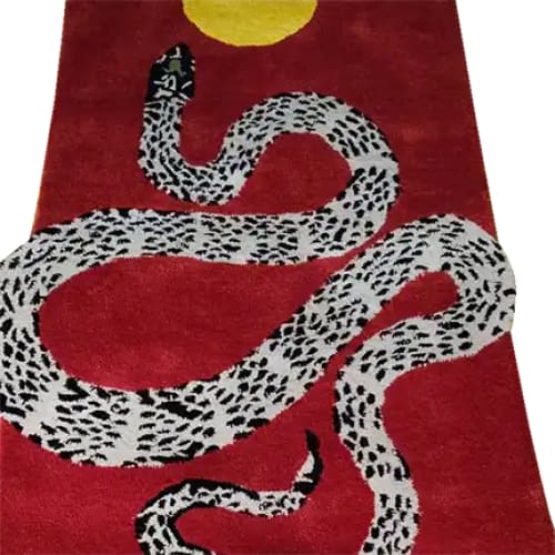 A vibrant red hand-tufted wool area rug featuring a striking black and white snake design coiled under a bright yellow sun. Perfect for adding a contemporary touch to living rooms, this 8x10 rug blends artistry with comfort, making it an ideal choice for those seeking stylish rugs for living room spaces.