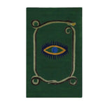 A unique area rug featuring a striking design with a central yellow evil eye surrounded by a coiling snake on a rich green background. This hand-tufted wool rug adds an artistic touch to any space, making it perfect for use as a kitchen rug, hallway runner rug, or in the dining room and bedroom. Its vintage charm and bold design make it a standout piece for those looking to enhance their decor with a stylish wool rug.