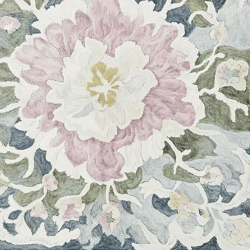 Close-up view of the Soft Bloom Rhapsody Hand Tufted Area Rug, showcasing an intricate floral design in soft pastel colors. This wool rug is perfect for adding a touch of elegance to living room spaces, especially in an 8x10 size.