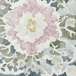 Close-up view of the Soft Bloom Rhapsody Hand Tufted Area Rug, showcasing an intricate floral design in soft pastel colors. This wool rug is perfect for adding a touch of elegance to living room spaces, especially in an 8x10 size.