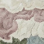 Close-up of a textured rug with circular patterns in various colors.