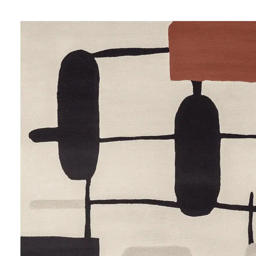 Close-up view of a contemporary area rug featuring a hand-tufted abstract design in black and brown on a cream background. This wool rug is perfect for adding a modern touch to large living rooms, making it an ideal choice for those seeking stylish rugs for living room spaces.