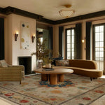 Cozy living room with a brown sofa, wooden coffee table, and decorative rug.