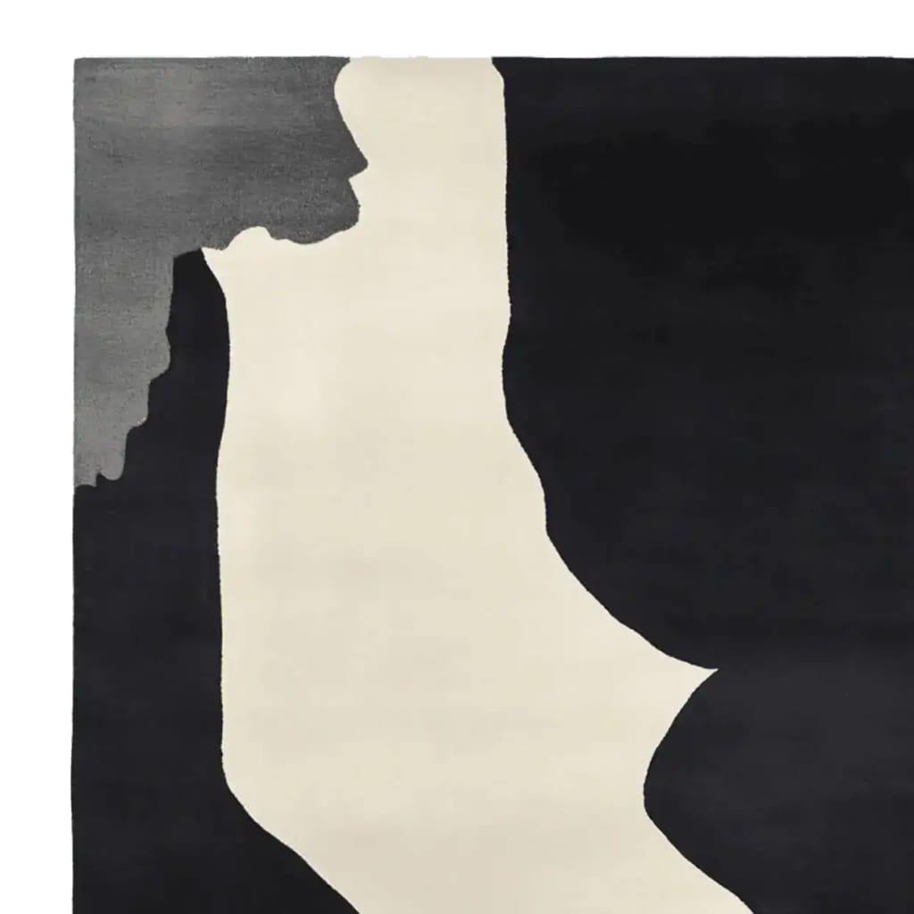 Contemporary area rug featuring an abstract design in black, gray, and white, ideal for modern living rooms. This 8x10 wool rug showcases a hand-tufted texture, perfect for adding a stylish touch to your home decor.