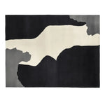 A contemporary area rug with a striking abstract design in shades of black, white, and gray, perfect for modern living rooms. This wool rug, sized 8x10, adds a bold artistic touch to any space, making it an ideal choice for those seeking stylish rugs for living rooms.