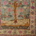 A beautifully detailed hand-knotted area rug featuring an intricate floral pattern with vibrant pink, red, and green hues. The design is reminiscent of traditional Persian rugs, perfect for adding elegance to any living room. This floral rug showcases a harmonious blend of colors and patterns, making it an exquisite choice for those seeking unique living room area rugs.