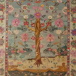 Beautiful hand-knotted area rug featuring an intricate floral design, ideal for enhancing living room decor. This Persian-inspired tapestry showcases a vibrant array of flowers and a central tree motif, embodying classic elegance and charm.