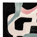 A contemporary wool area rug with an abstract design featuring flowing curves in soft pastel shades of pink, blue, and cream against a black background. Perfect for adding a modern touch to living room area rugs, especially in an 8x10 space.