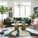 Modern living room with a green sofa, colorful rug, and decorative elements.