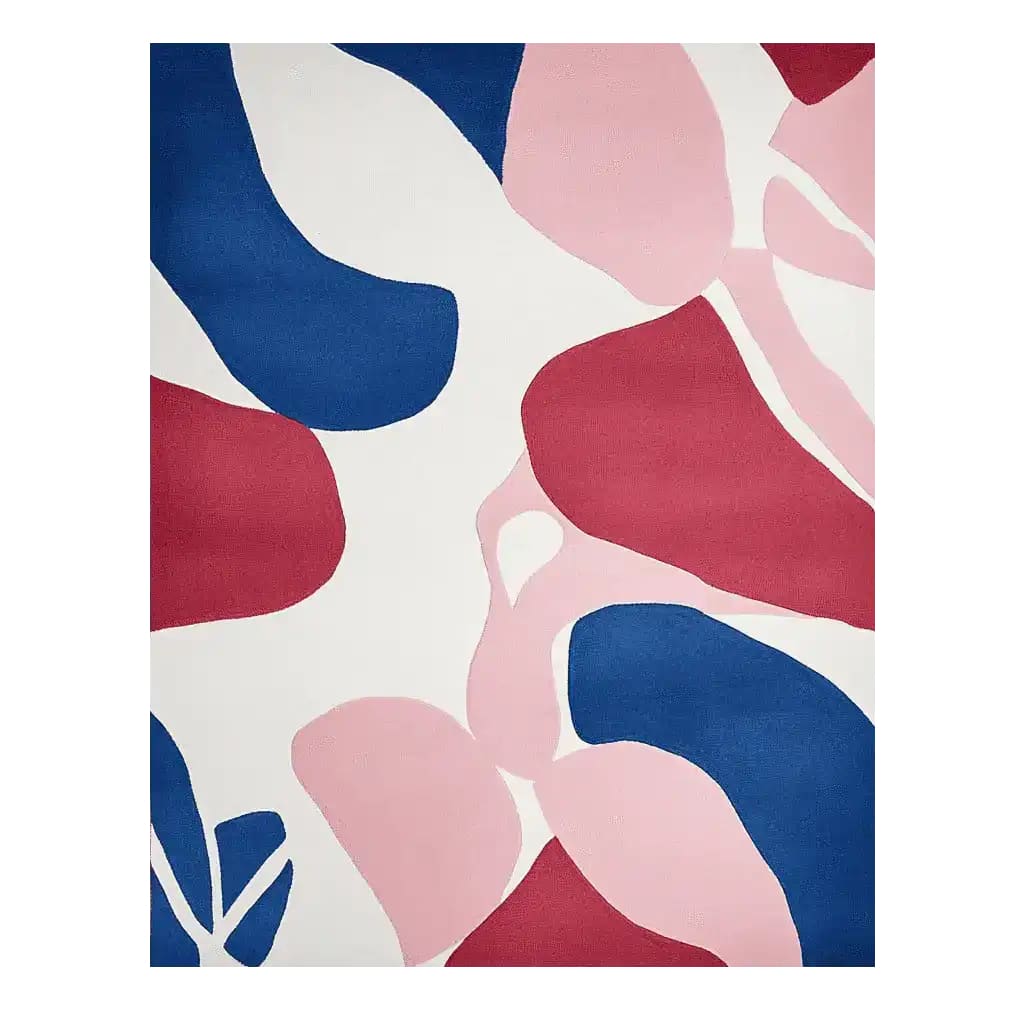 Top view of a contemporary area rug displaying an abstract design with bold blue, red, and pink shapes on a soft white background. This hand-tufted wool rug is perfect for adding a modern touch to living room spaces.
