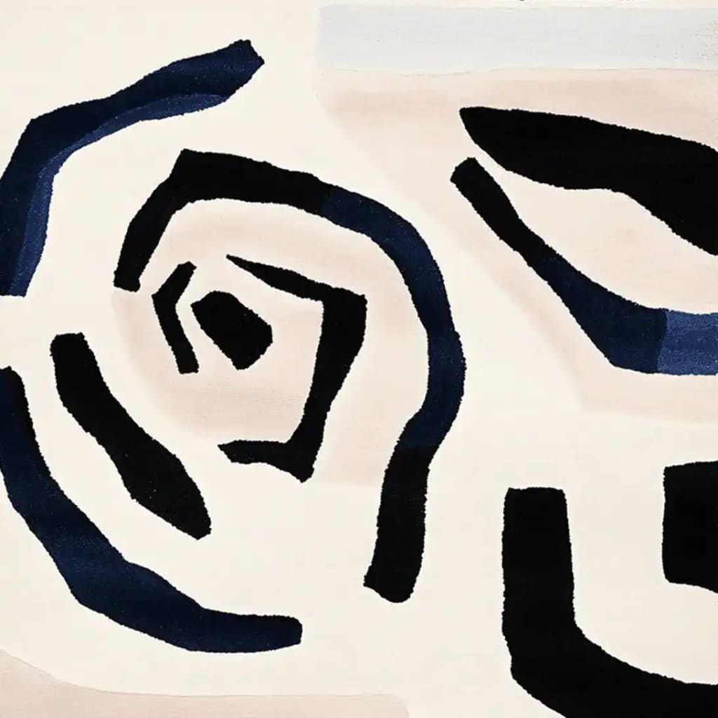 Top view of a Soft Spiral Echo Hand Tufted Area Rug featuring an abstract design in navy and black on a beige background, perfect for contemporary living room decor. This wool rug adds a modern touch to any living space, making it an ideal choice for area rugs for the living room.