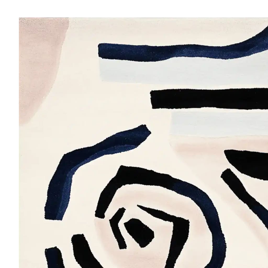 Close-up view of the Soft Spiral Echo Hand Tufted Area Rug showcasing its contemporary design. This wool rug features abstract black and blue spiral patterns on a light background, perfect for enhancing living room decor. An ideal choice for those seeking stylish area rugs for living rooms.