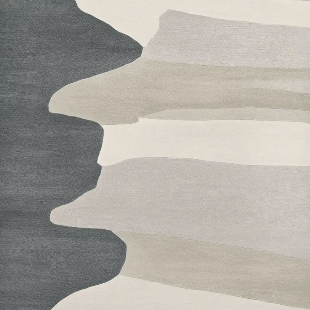 A contemporary hand-tufted wool area rug featuring abstract, flowing patterns in shades of gray and beige, ideal for a large living room setting. This modern 8x10 rug adds a sophisticated touch to any space.