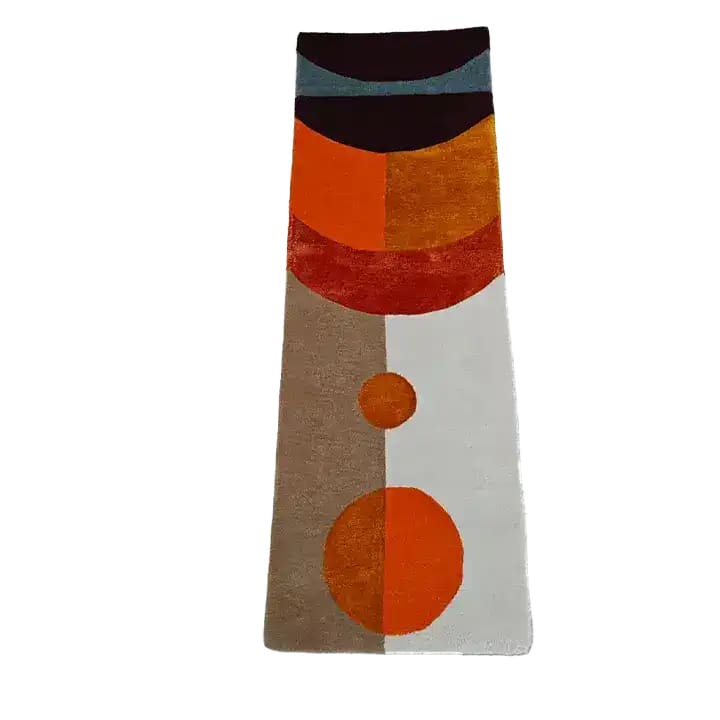 Top view of a Solar Eclipse Hand Tufted Wool Rug Runner showcasing a contemporary design with geometric patterns in shades of orange, brown, and white. Ideal as an area rug for living rooms, or as a hallway runner rug. This stylish wool rug adds a modern touch to kitchen spaces, making it perfect for a kitchen runner rug or even as a bathroom runner rug.