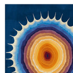 This vibrant area rug showcases a stunning abstract design reminiscent of solar flares, with rich layers of orange, blue, and purple hues radiating from the center. Perfect for contemporary spaces, this wool rug adds a bold statement to any living room. Ideal for an 8x10 setting, this piece highlights the art of hand tufting, making it a standout among area rugs for living rooms.