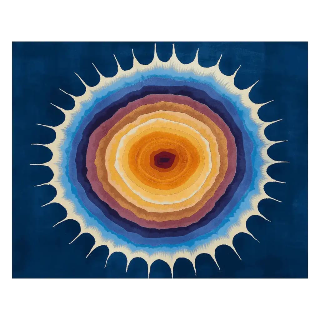 A vibrant Solar Flare Bloom Hand Tufted Area Rug, perfect for adding a contemporary touch to your living space. This wool rug features a stunning circular design with layers of blue, orange, and cream hues, ideal for living room rugs 8x10 or area rugs for living room settings.