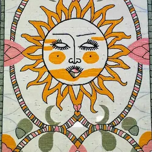 A beautifully designed area rug featuring a whimsical sun motif with a face, surrounded by intricate patterns in shades of orange, pink, and green. This wool rug adds a vibrant and artistic touch to any living room space.