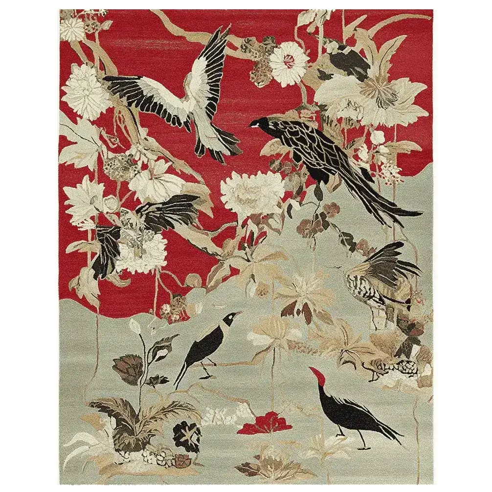 The 'Song of the Skies Hand Tufted Rug' is a stunning area rug crafted from wool, ideal for adding elegance to living room spaces. The design features a vibrant depiction of birds and flowers against a rich red and muted beige background, making it a captivating large living room rug.