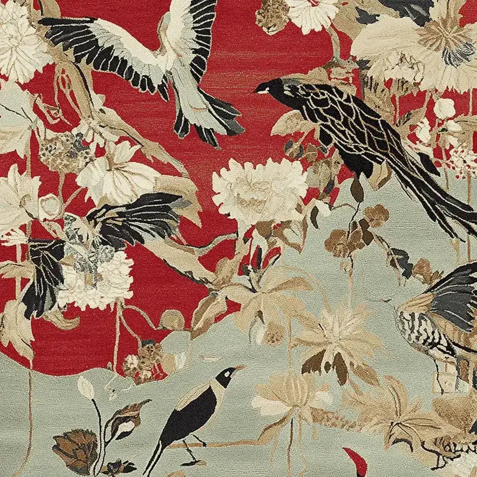 A beautifully designed hand tufted area rug featuring a vibrant pattern with birds and flowers. The wool rug displays a rich color palette of reds, blacks, and creams, making it an eye-catching piece for any living room. This large living room rug combines artistry and functionality, adding warmth and style to your space.