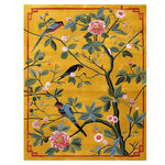 The Songbird Blossom Dance hand-tufted area rug features a vibrant design of colorful birds perched on branches with pink blossoms on a rich yellow backdrop. This contemporary wool rug is perfect for adding a splash of nature to your living room, ideal as an 8x10 living room rug.