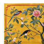 This hand-tufted area rug showcases a vibrant design of songbirds and blossoms, perfect for adding a contemporary touch to your living room. The wool rug features intricate details on a golden background, ideal for those seeking rugs for living room in an 8x10 size.