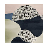 A contemporary area rug showcasing an abstract design with speckled patterns in black and white, complemented by muted tones of pink, blue, and green. This wool rug is perfect for adding a modern touch to your living room decor, offering both style and comfort.