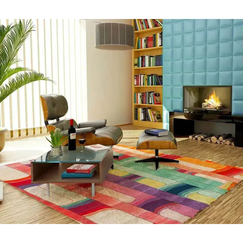 A vibrant Spectrum Stripe Hand Tufted Area Rug in an 8x10 size elegantly enhances a contemporary living room setting. The large wool rug features bold, colorful stripes, adding a modern touch to the space. Positioned in front of a cozy fireplace, it complements the stylish furniture and decor, making it an ideal choice for large living room rugs.