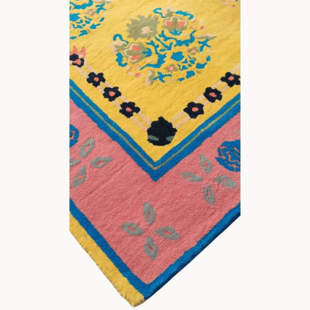 Close-up of a vibrant Spring Blossom Traditional Hand Tufted Area Rug in a 5 x 7.5 ft size, showcasing intricate floral patterns in yellow, pink, and blue hues, ideal for living room decor. This wool rug adds a boho touch to large area rugs collection, perfect for those seeking stylish living room rugs 8x10.