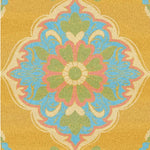 A vibrant Spring Blossom Traditional Hand Tufted Area Rug showcasing an intricate floral pattern with green, blue, and pink motifs on a warm yellow background. Perfect for adding a touch of elegance to the dining room or living room, this wool rug embodies boho charm, making it ideal for both formal dining room settings and casual living spaces.