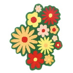 Vibrant wool area rug featuring a colorful array of spring flowers set against a lush green background, perfect for adding a touch of nature to any office space.