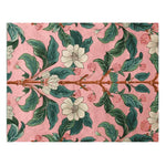 Vibrant Spring Garden Petals Hand Tufted Area Rug showcasing a stunning floral design. This wool rug features intricate green leaves and delicate white flowers against a soft pink backdrop, perfect for large area rugs in the living room.