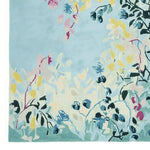 The Spring Garden Whisper Hand Tufted Rug is a stunning wool area rug featuring a contemporary floral design. This 8x10 living room rug showcases a blend of soft pastel colors with intricate, abstract floral patterns, perfect for adding a touch of elegance to any living space.