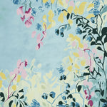Vibrant Spring Garden Whisper Hand Tufted Area Rug featuring a contemporary abstract floral design in pastel colors on a light blue background. This wool rug is perfect for adding a fresh touch to your living room. Ideal for living room rugs 8x10 and area rugs for living room.