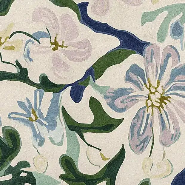 Close-up of the Spring Meadow Flow Hand Tufted Area Rug, showcasing its contemporary floral design with soft, pastel colors. This wool rug is an elegant addition to any living room decor.