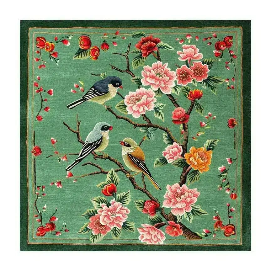 The Springtime Serenade Hand Tufted Rug is a stunning square area rug, featuring a vibrant design with colorful birds perched on blossoming branches. Perfect for adding a touch of nature to your living room, this wool rug combines artistry with functionality. Ideal for those seeking large area rugs for living room spaces.