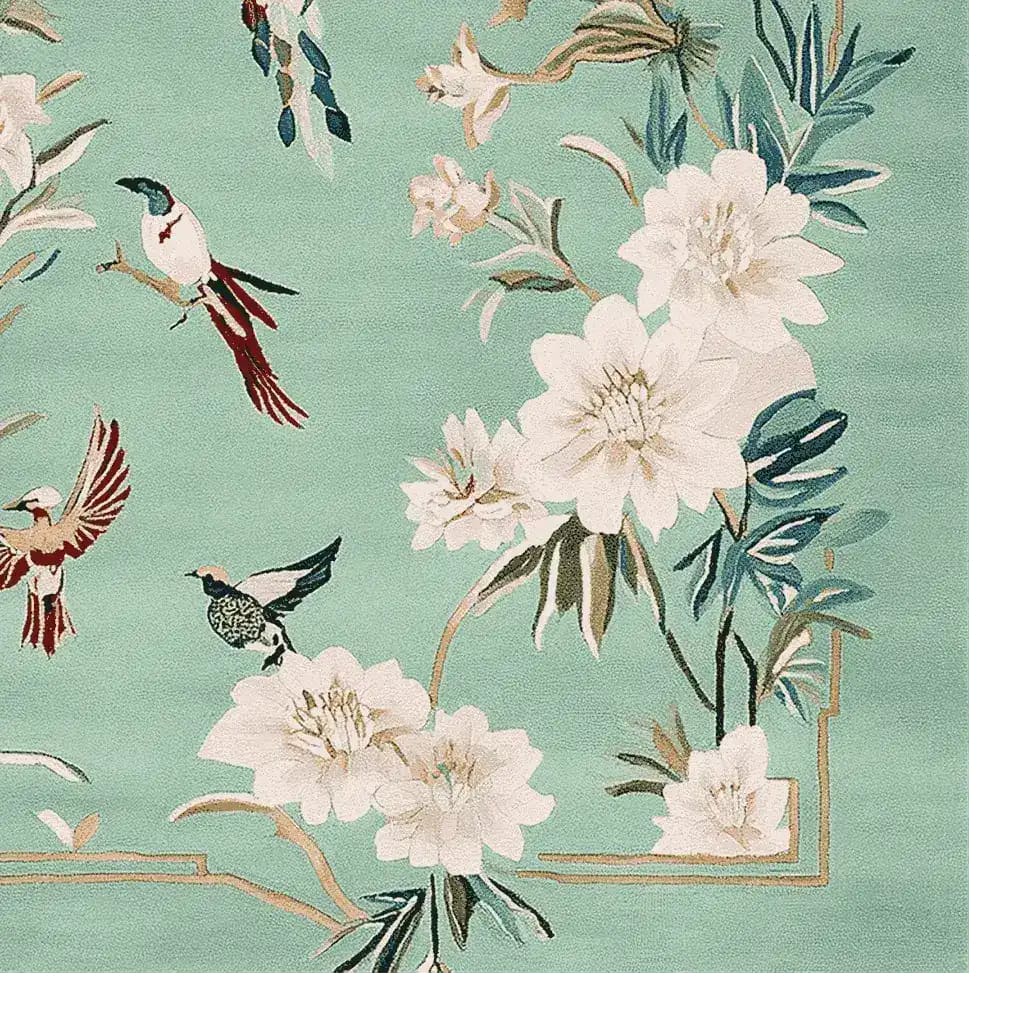A beautifully designed hand-tufted area rug featuring a vibrant springtime theme. This wool rug showcases intricate floral patterns and colorful birds, perfect for adding elegance to any living room.
