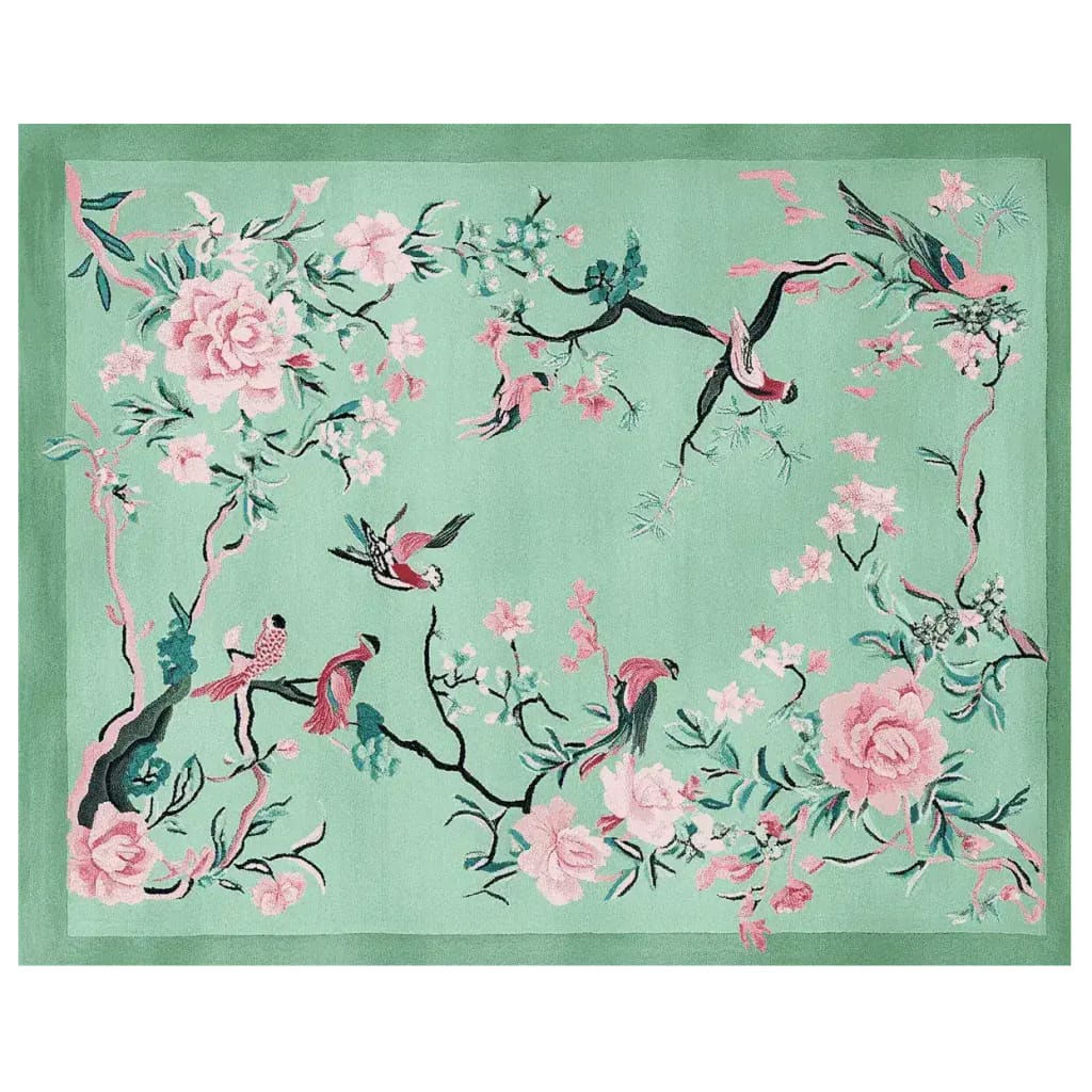 A beautifully crafted area rug featuring a springtime theme with intricate floral and bird designs. This elegant wool rug is perfect for adding a touch of nature to your living room, showcasing vibrant pink and green hues against a soft background.