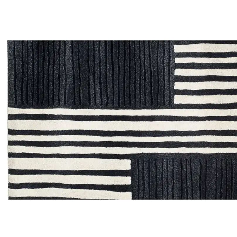 The Star Dance Hand Tufted Wool Rug features a striking black and white geometric pattern, perfect for adding a contemporary touch to your space. Ideal as a runner rug for kitchens, bathrooms, or hallways, this wool rug combines style and functionality effortlessly.