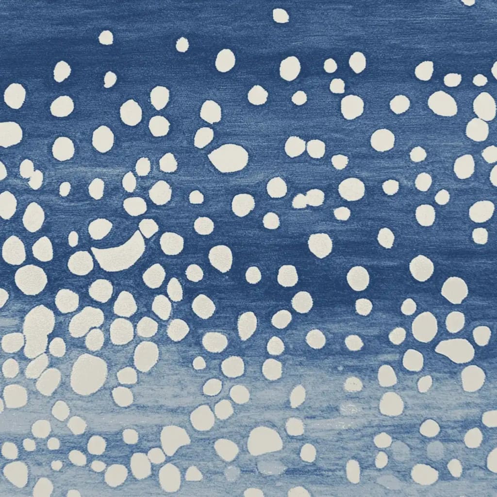 This image shows a contemporary wool rug with a vibrant indigo background featuring an abstract pattern of white dots. Ideal for adding a modern touch to your living space, this area rug is perfect for living room decor. The 8x10 size makes it a versatile choice for various room layouts.
