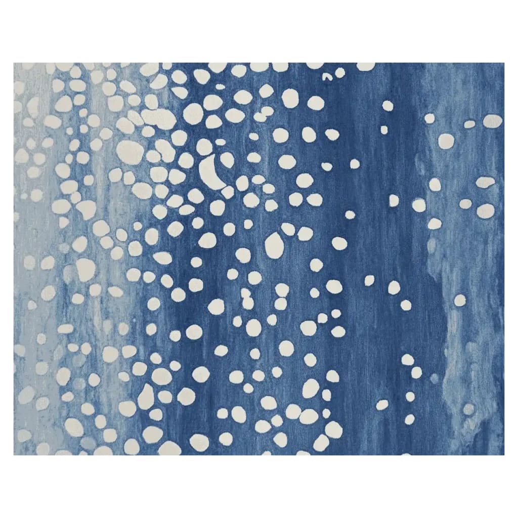 This image showcases the 'Starfall in Indigo' hand-tufted area rug. The contemporary rug features a captivating design with a deep indigo background speckled with abstract white dots, giving it a celestial feel. Perfect for those seeking area rugs for living room spaces, this 8x10 wool rug adds a modern touch to any interior.