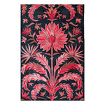 Starry pink garden rug with coral floral and palm-leaf motifs on a near-black navy ground