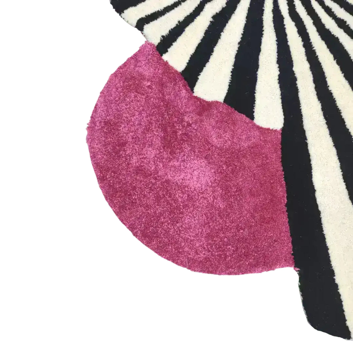 Close-up of a vibrant wool area rug, showcasing a striking design with bold black and white stripes alongside a rich pink section. Perfect for adding a touch of vintage charm to large living rooms, this hand-tufted rug is an ideal choice for those seeking stylish area rugs for their living space.