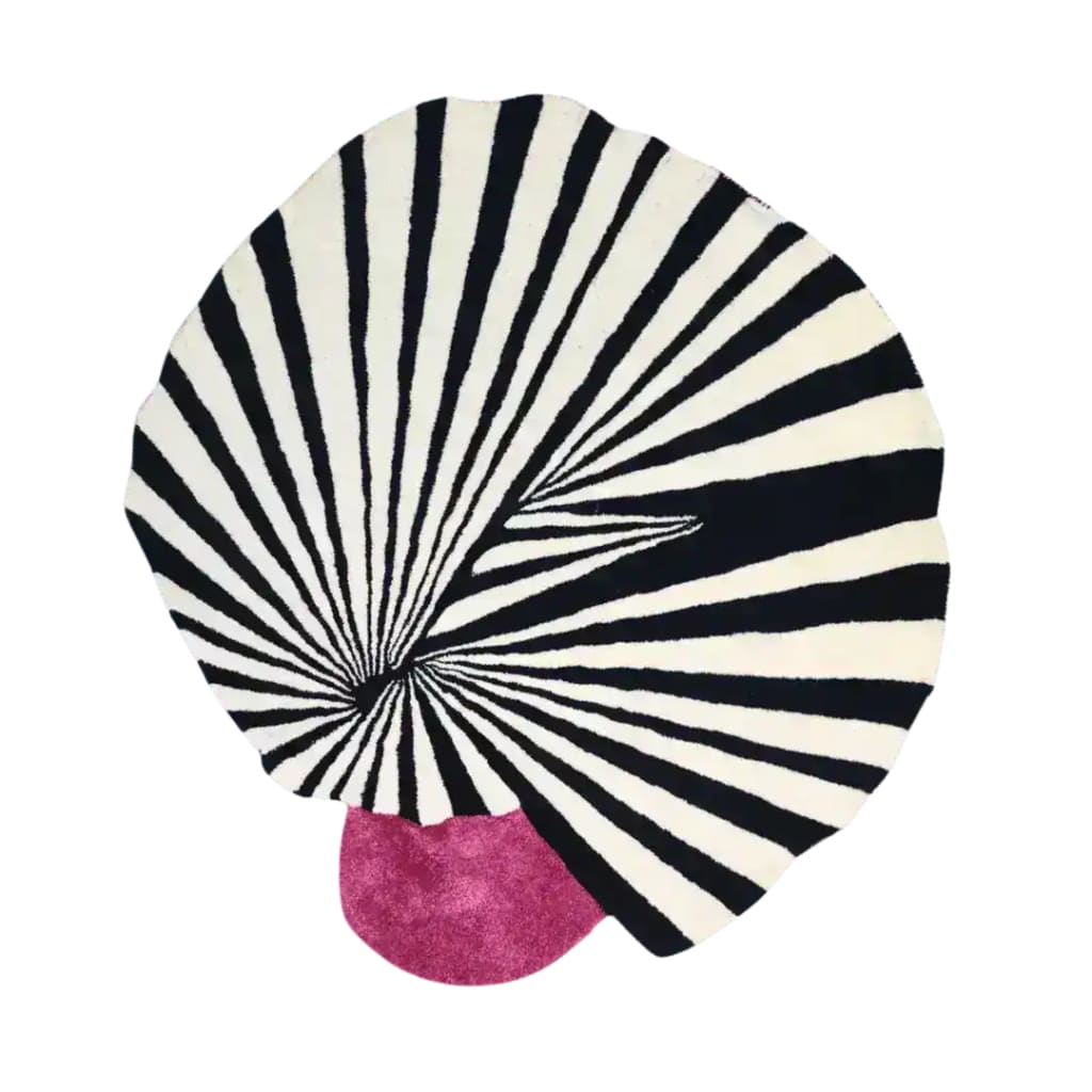 A striking area rug featuring a bold, swirling black and white pattern with a pop of pink, ideal for large living rooms. This hand tufted wool rug adds a vintage touch to any living room, making it a standout among area rugs for living rooms.