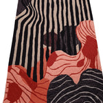Abstract pattern with black, beige, and red shapes rug on a transparent background