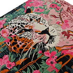 This vibrant hand-tufted wool rug features a striking design with a leopard surrounded by colorful floral patterns, perfect for adding a bold touch to large living room spaces. The square area rug's intricate details and blend of colors make it an ideal choice for those seeking a unique and artistic floral rug. Perfect for anyone looking to enhance their living room area with a statement piece.