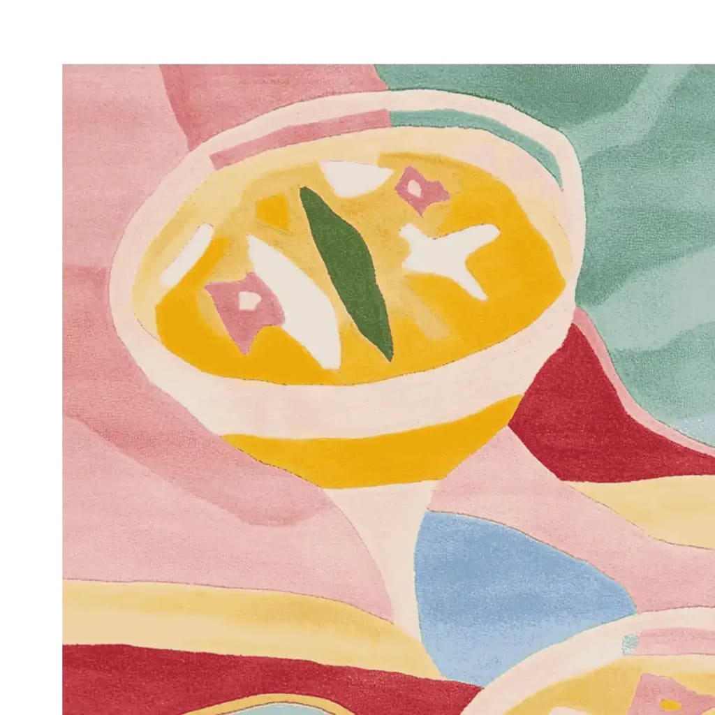 Close-up view of the 'Summer Cheers Hand Tufted Rug' featuring a vibrant abstract design with cocktail motifs in warm colors. This contemporary wool area rug is perfect for adding a splash of color to large living rooms.