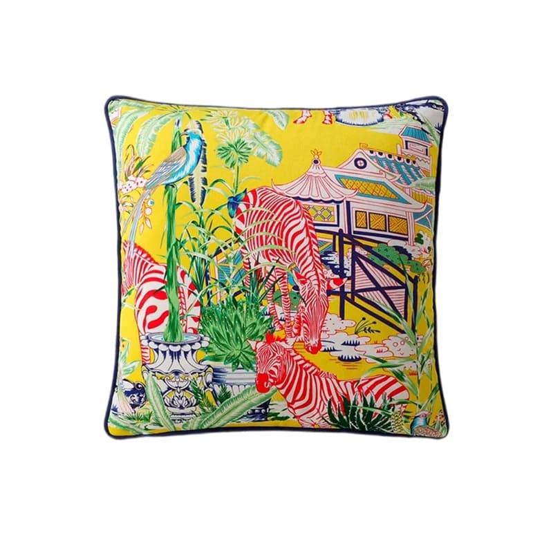 Bright and colorful throw pillow featuring zebras and tropical plants on a yellow background, perfect for adding a vibrant touch to home decor.